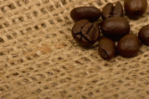 Coffee beans on sack — Stock Photo, Image