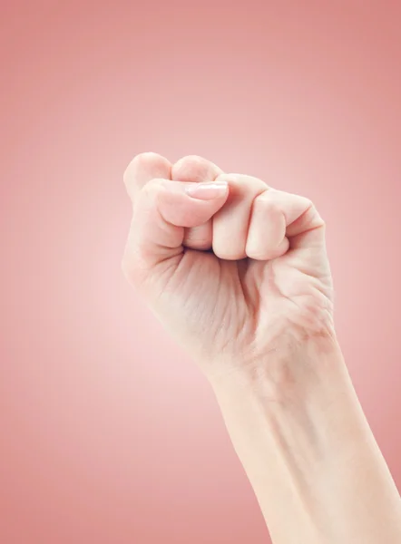 Fist on pink background — Stock Photo, Image