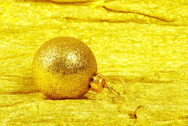 Christmas ball on golden — Stock Photo, Image