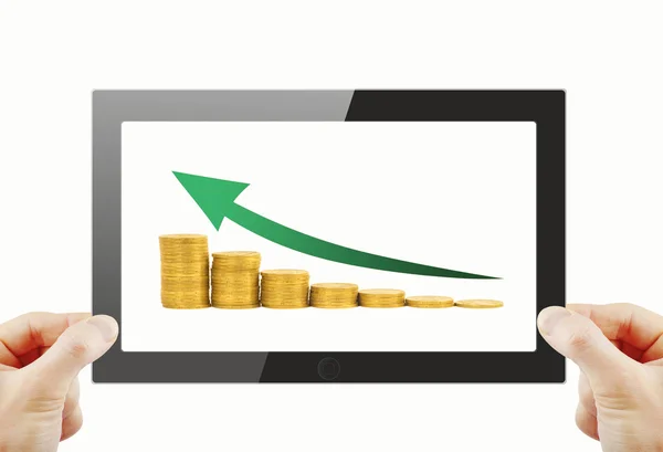 Tablet pc with coins and green arrow — Stock Photo, Image