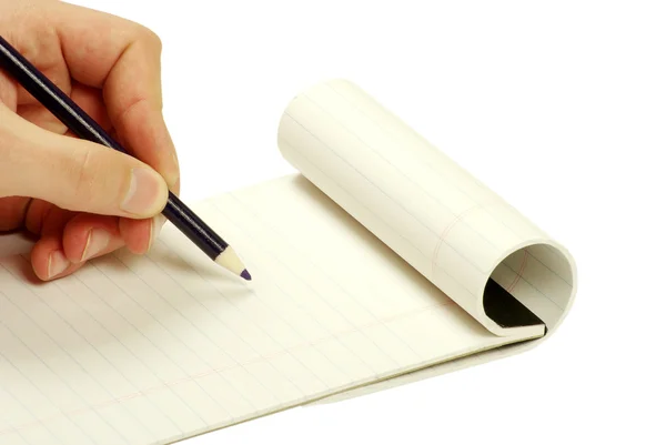 Pensil di tangan menulis pada notebook — Stok Foto
