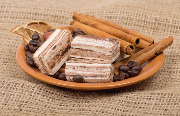 Sweets, cinnamon, nuts and coffee beans — Stock Photo, Image