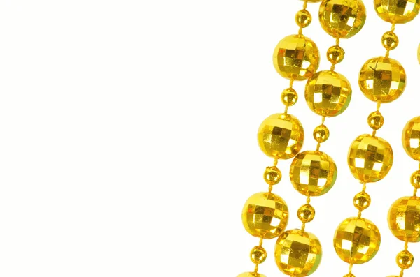 Feestelijke kralen van gouden kleur — Stockfoto