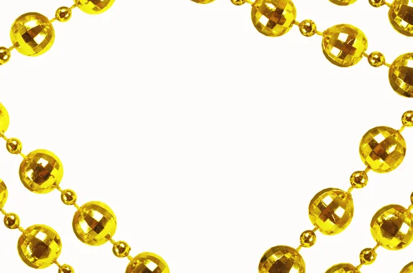 Golden beads with empty copy space — Stock Photo, Image