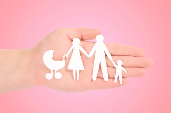 Paper family in human hand — Stock Photo, Image