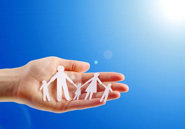 Paper family in human hand — Stock Photo, Image