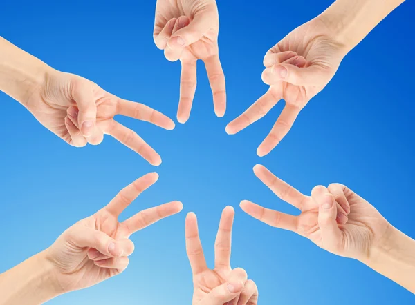 Hands forming star shape — Stock Photo, Image