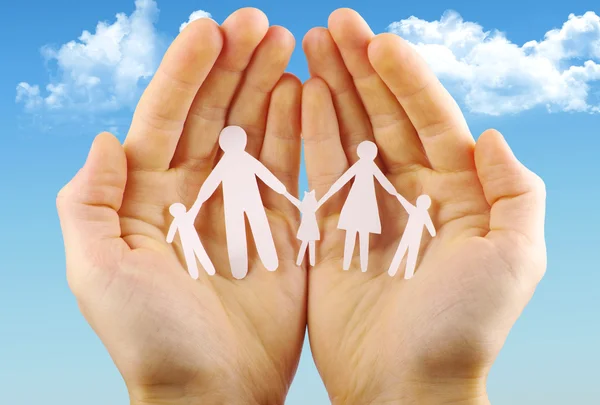 Paper family in human hands — Stock Photo, Image