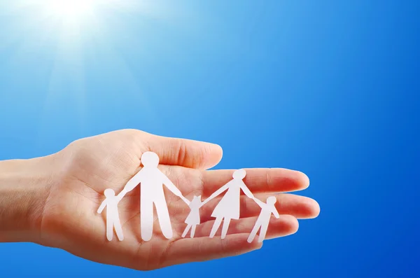 Paper family in human hand — Stock Photo, Image