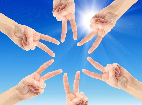 Hands forming star shape — Stock Photo, Image