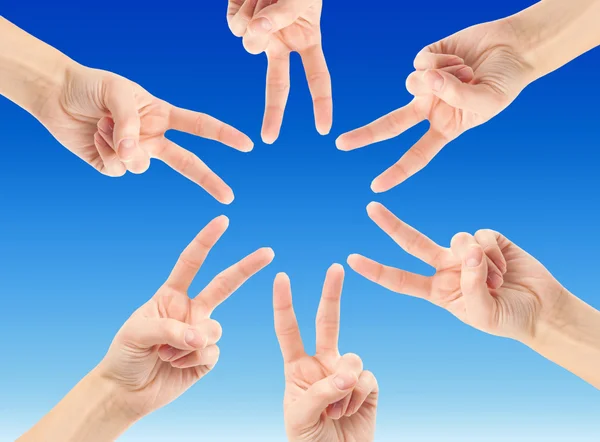 Hands forming star shape — Stock Photo, Image