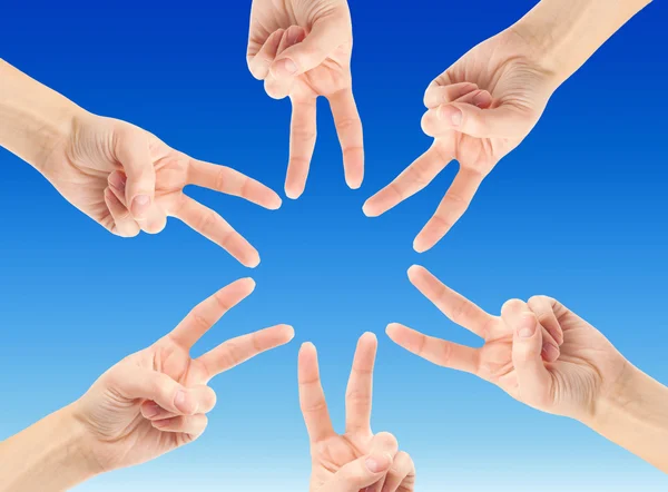 Hands forming star shape — Stock Photo, Image