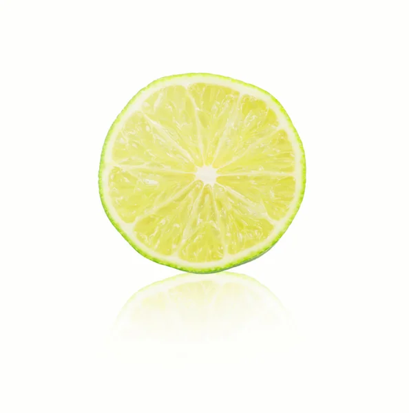 Lime szeletet a fehér háttér — Stock Fotó
