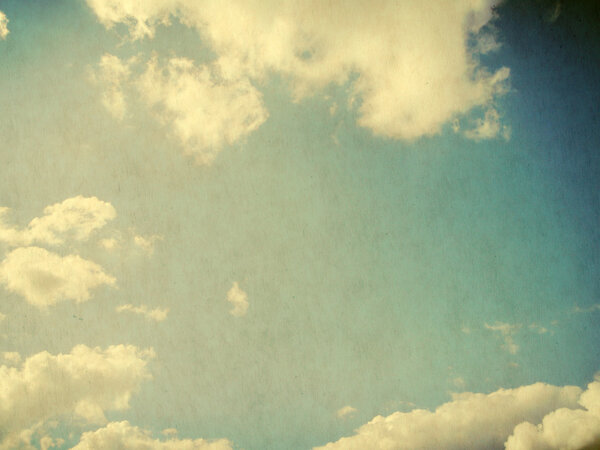 Vintage background in the blue sky with clouds