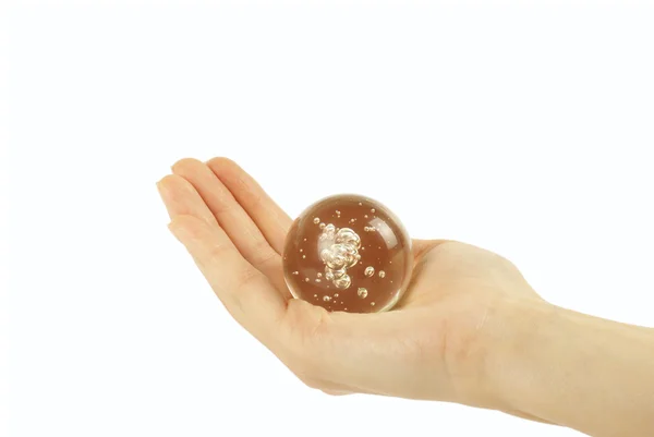 Mão segurando uma bola de cristal — Fotografia de Stock