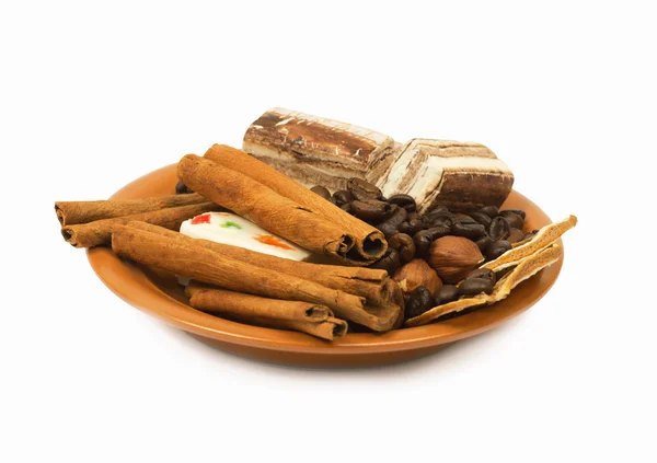 Sweets, cinnamon, nuts and coffee beans — Stock Photo, Image