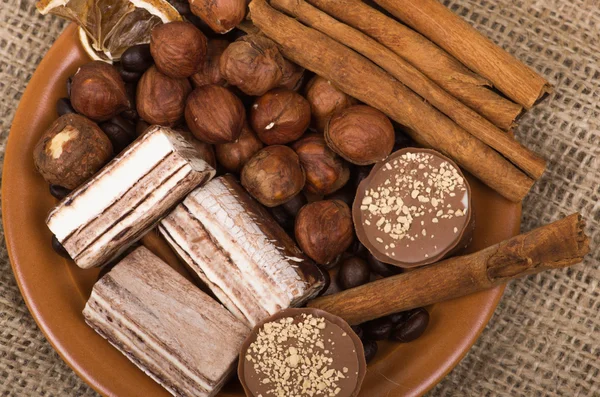 Sweets, cinnamon, nuts and coffee beans — Stock Photo, Image