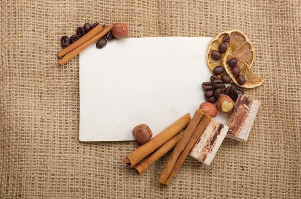 Old paper, coffee beans, cinnamon — Stock Photo, Image