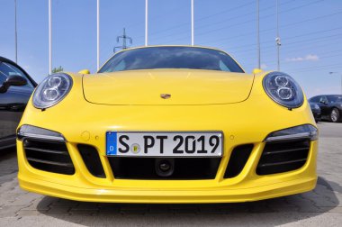 Yellow Porsche 911 Carrera 4 GTS