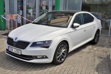 Skoda Superb in front of car store