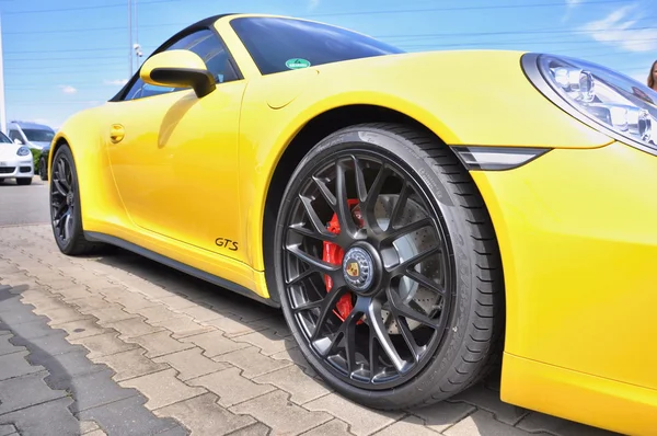 Yellow Porsche 911 Carrera 4 GTS