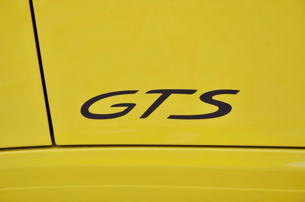 GTS inscription on Yellow Porsche 911 Carrera 4 GTS — 图库照片