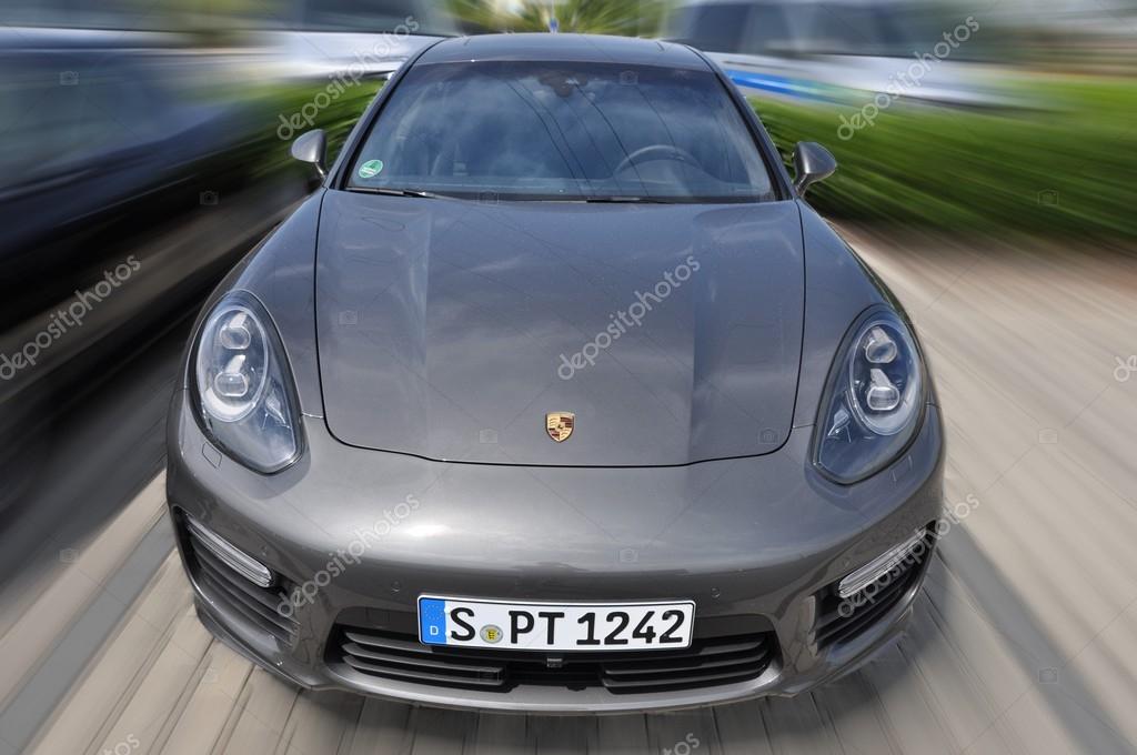 PRAGUE, THE CZECH REPUBLIC, 02.08.2015 - Speeding new Porsche Panamera on road