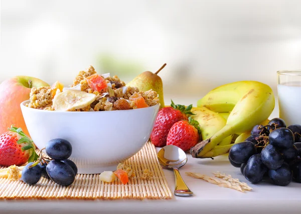 Bowl of cereal and fruits front view in the kitchen — Stock Photo, Image