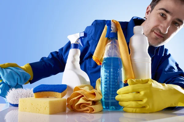 Cleaning service products and employee looking