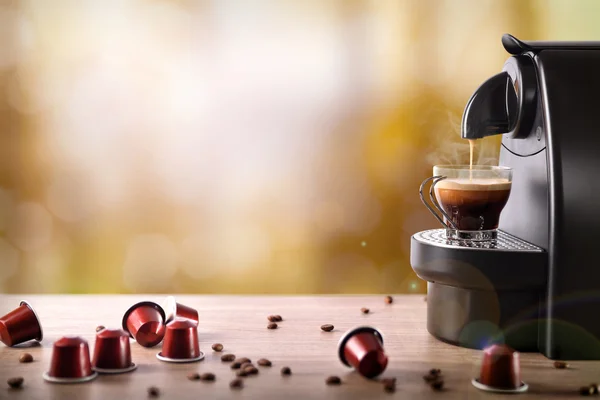 Espresso machine making coffee on wood table front view — Stock Photo, Image