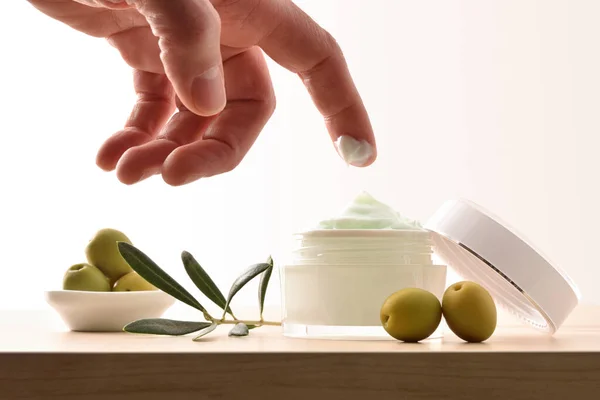 Hands Taking Sample Olive Moisturizer Skin Branch Olives Wooden Table — Stock Photo, Image