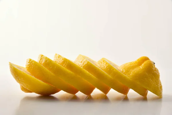 Detail Lemon Cut Slices White Table White Isolated Background Front — Stock Photo, Image