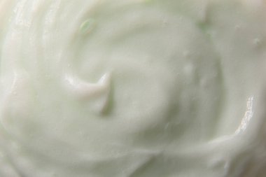 Yeşilimsi vücut kremi deseni soyut arka plan. Yatay bileşim.