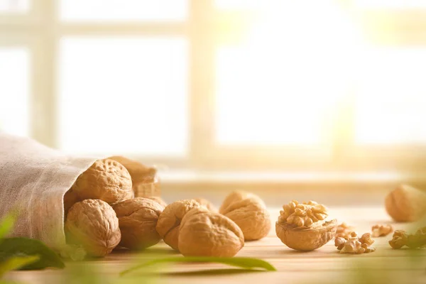 Sack Nuts Seeds Wooden Table Bright Window Background Front View — Stock Photo, Image