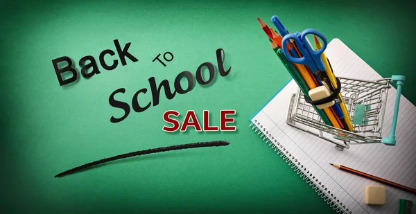 Back School Sale Cart Full Supplies Notebook Green Background Text — Stock Photo, Image