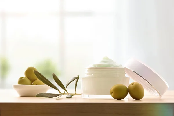 Moisturizing Cosmetic Cream Olive Extract Skin Branch Olives Wooden Table — Stock Photo, Image