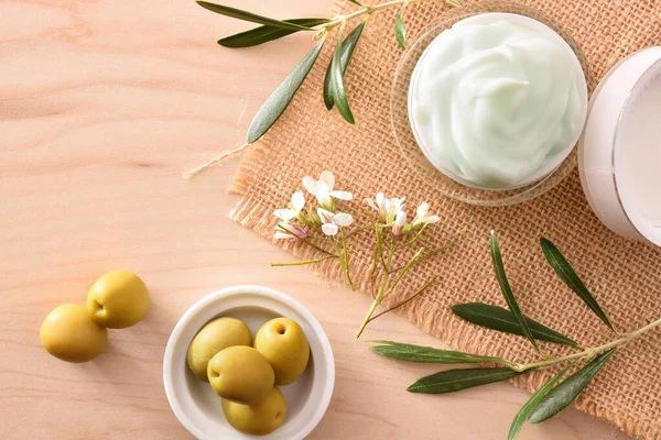 Moisturizing Cosmetic Cream Olive Extract Skin Branch Olives Wood Table — Stock Photo, Image