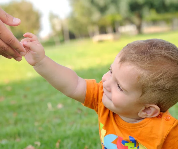 Father reaching out to his son — Stock Photo, Image