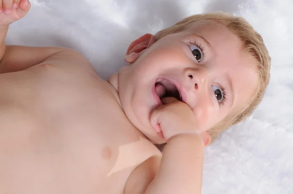 Growing out baby teeth biting the hand — Stock Photo, Image