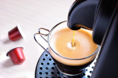 machine serving espresso coffee top view