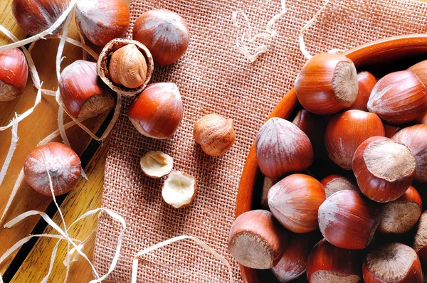 Group of  hazelnuts on a wooden table top view — Stock Photo, Image