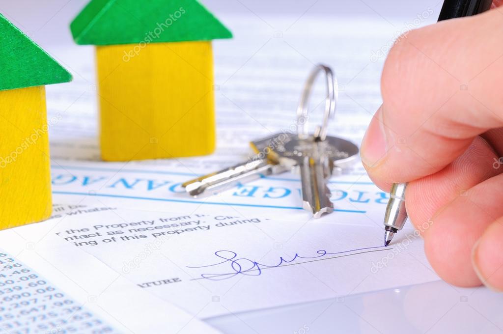 Signing the mortgage contract to delivery of keys with wooden ho