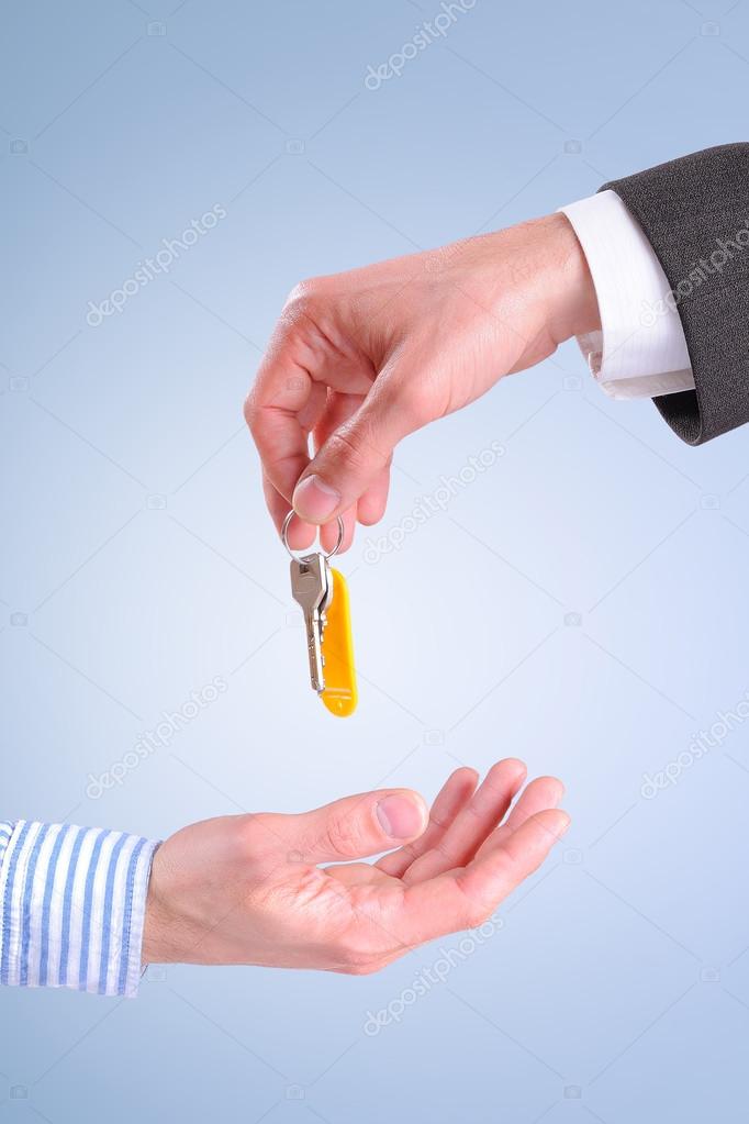 Commercial agent giving keys to customer isolated vertical compo