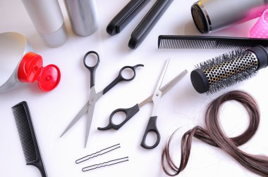 Set hairdressing articles on a white table top view clipart