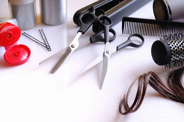 Set hairdressing articles on a white table composition — Stock Photo, Image