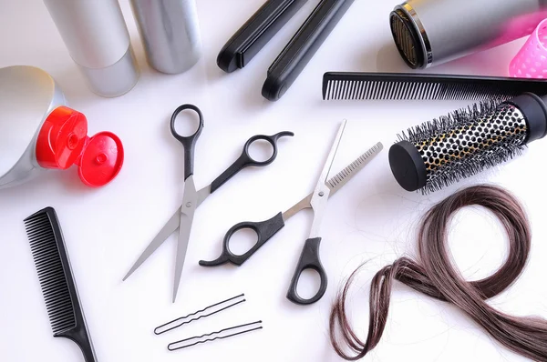 Set hairdressing articles on a white table top view — Stock Photo, Image