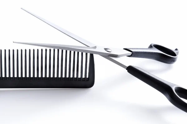 Barber scissors and comb closeup front view — Stock Photo, Image
