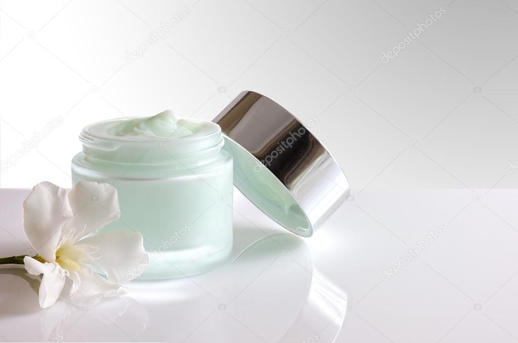 Cream jar open with lid front view isolated