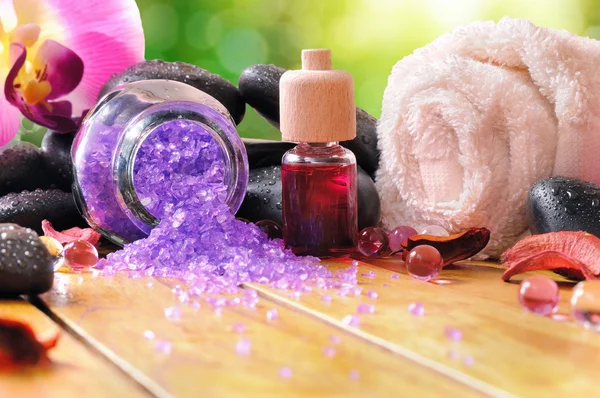 Bath salts and oils on wooden in nature front view — Stock Photo, Image