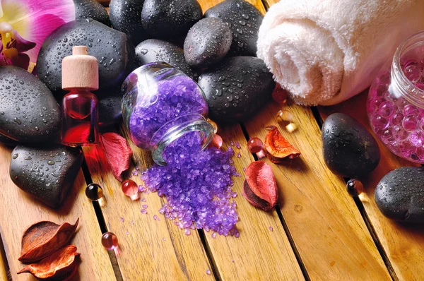 Black stones, and essences for body care — Stock Photo, Image